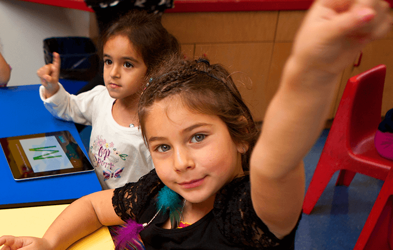 Students flipping the script Diverse group of elementary school children