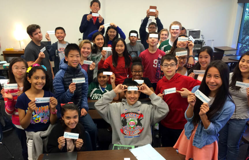 Group of kids holding stickers 